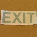 SIGN, EXIT PHOTOLUMINESCENT 4" X 10" GREEN LETTERS